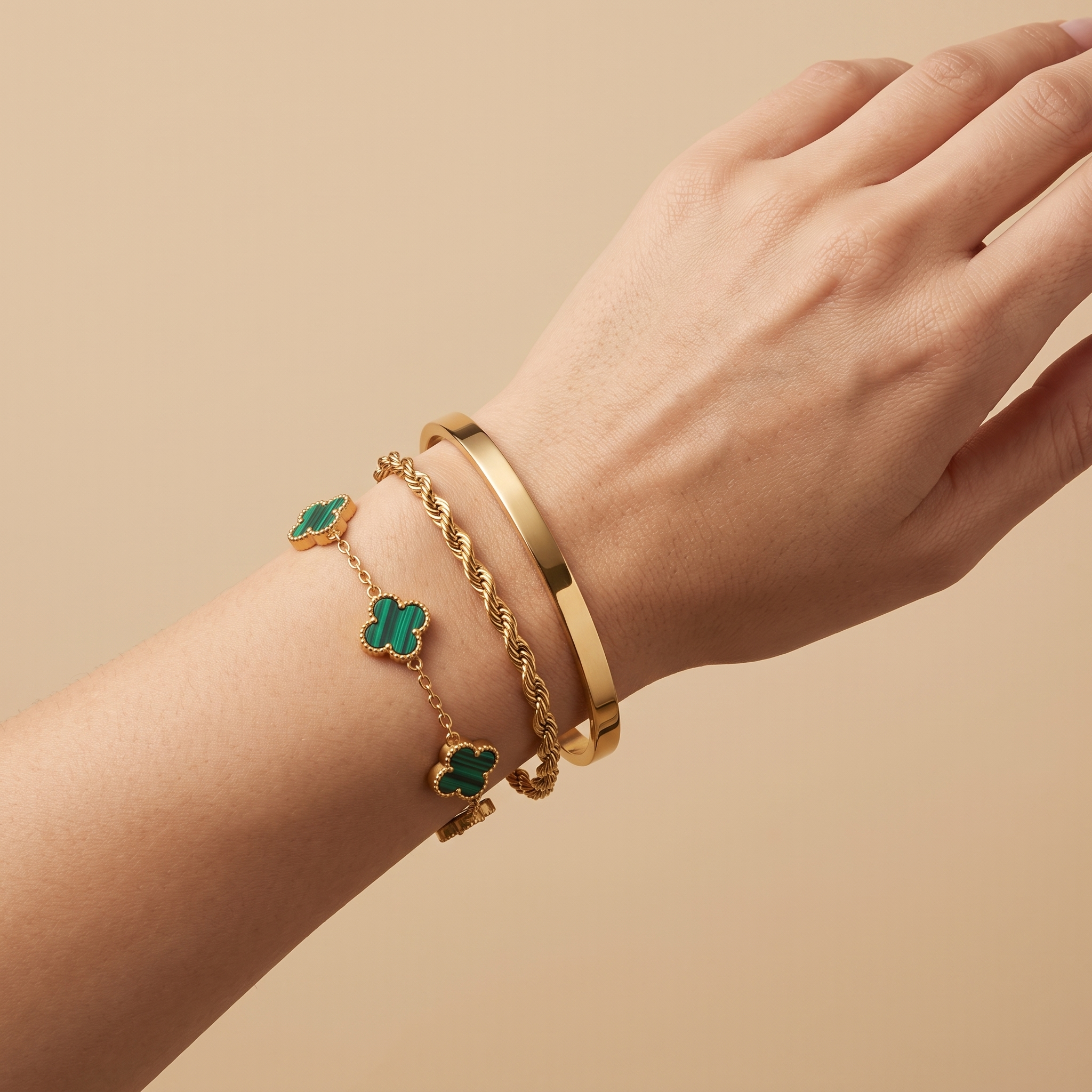 The Versailles Stack on model — gold bracelet stack, champagne editorial