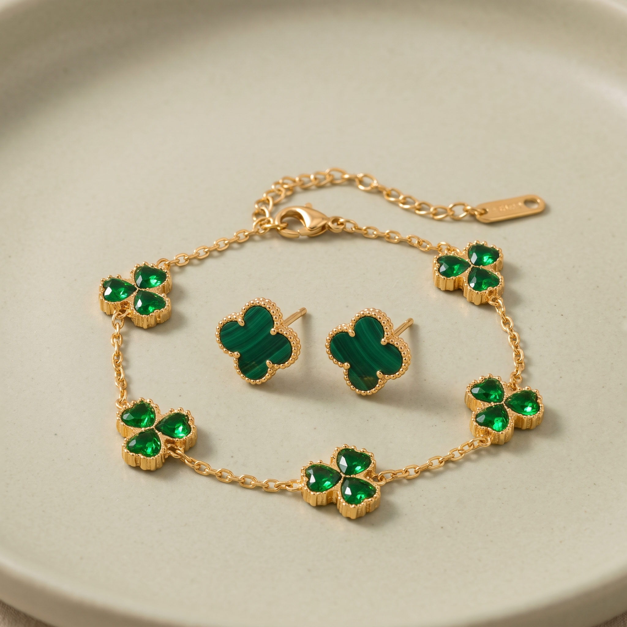 The Clover Petite Set — dainty bracelet and studs on pale sage