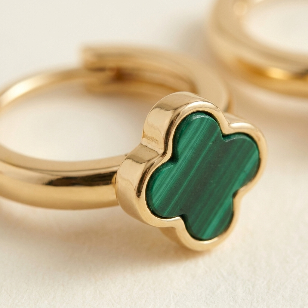 DEAUVILLE Clover Huggies — macro detail of clover charm and clasp