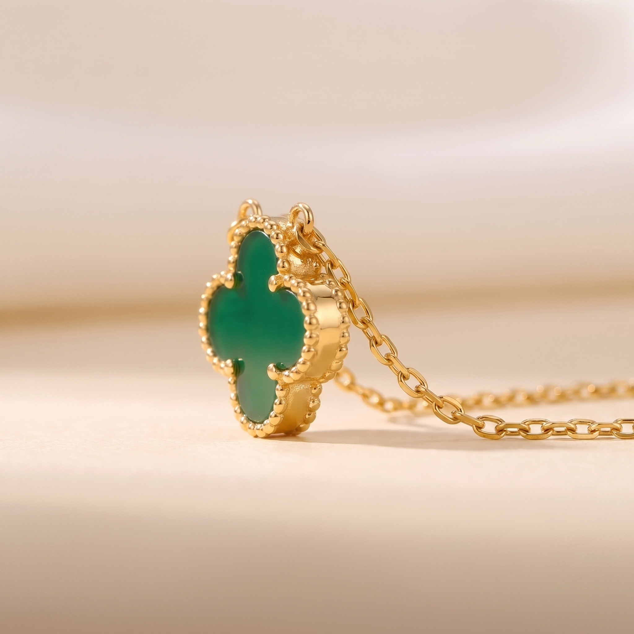 The Clover Set — macro detail of the clover pendant and chain